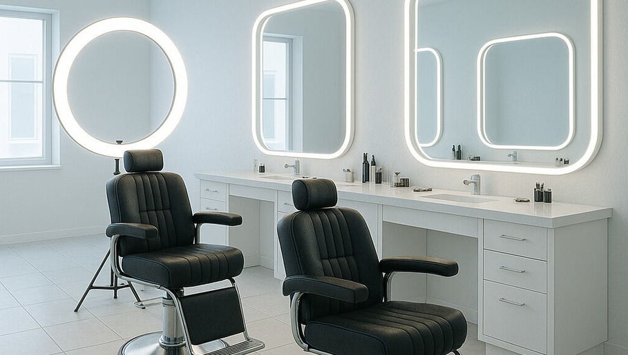 Elegant interior of DY Barbers with stylish chairs and mirrors in Birmingham, England, GB.