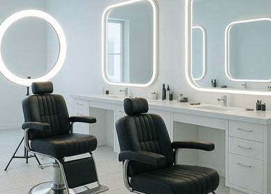 Elegant interior of DY Barbers with stylish chairs and mirrors in Birmingham, England, GB.