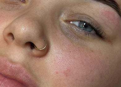 Close-up of a serene face showcasing skincare results at Beauty By Ells, Riddings, England, GB.