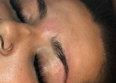 Close-up of relaxed client with perfect brows at Beauty By Ells, Riddings, England, GB.