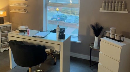 BeautyByElls salon in Ilkeston, England, showcasing a stylish nail station and modern decor.