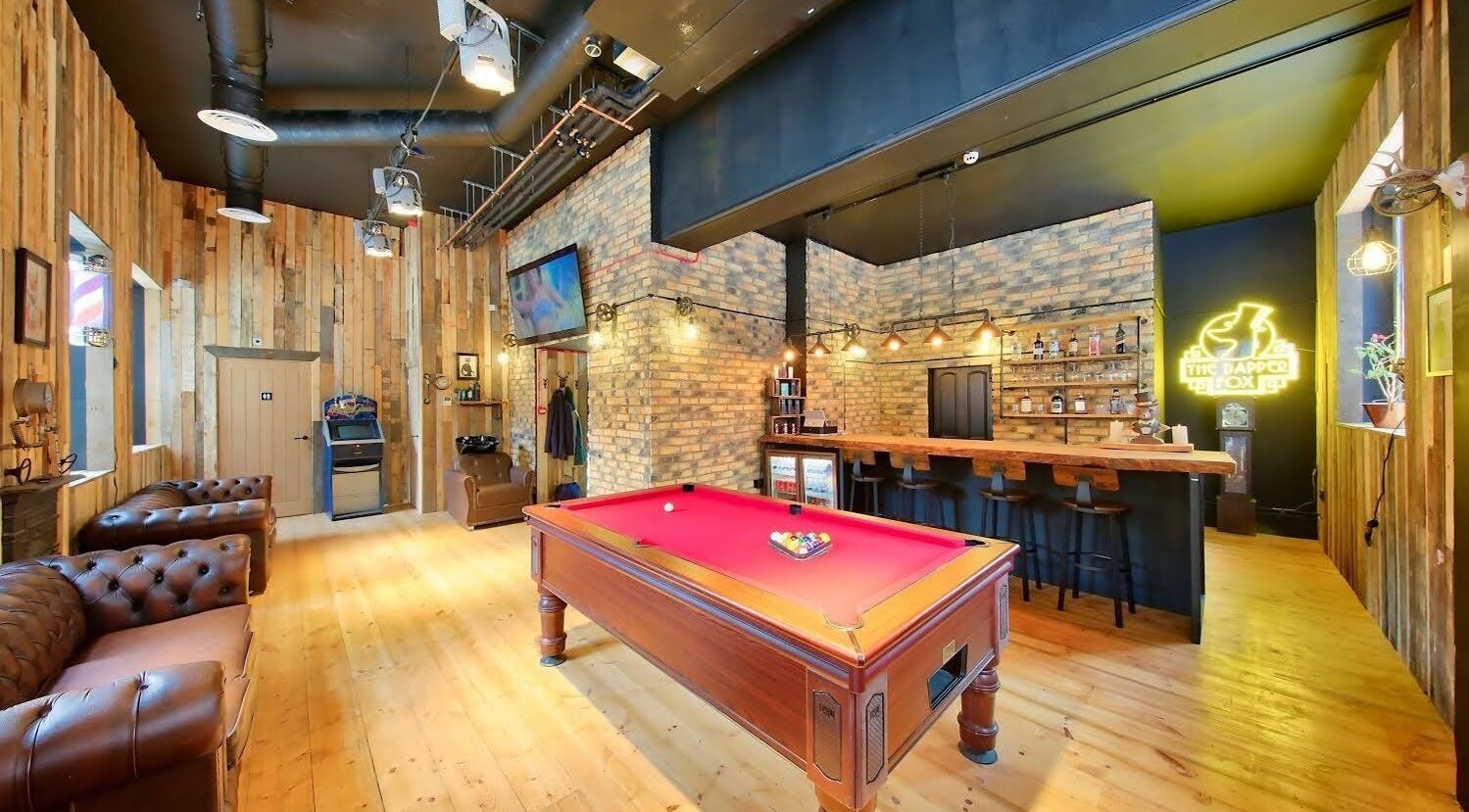 Cozy lounge with pool table at The Dapper Fox - Wandsworth, London, England, GB. Stylish and inviting atmosphere.