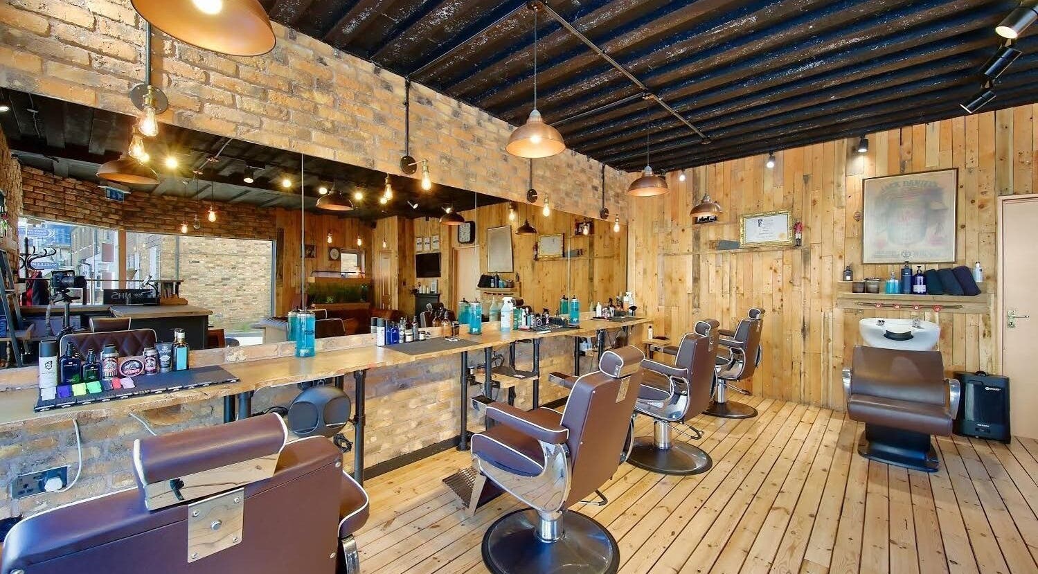 Interior of The Dapper Fox - Hampton Wick, a rustic barbershop in Hampton Wick, England, GB with wooden decor.