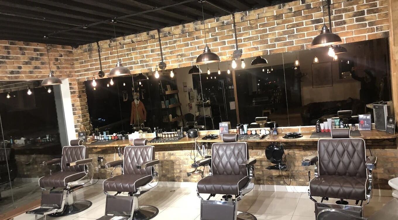 Sleek barber chairs at The Dapper Fox - Hampton Wick, Hampton Wick, England, GB in a stylish, rustic setting.