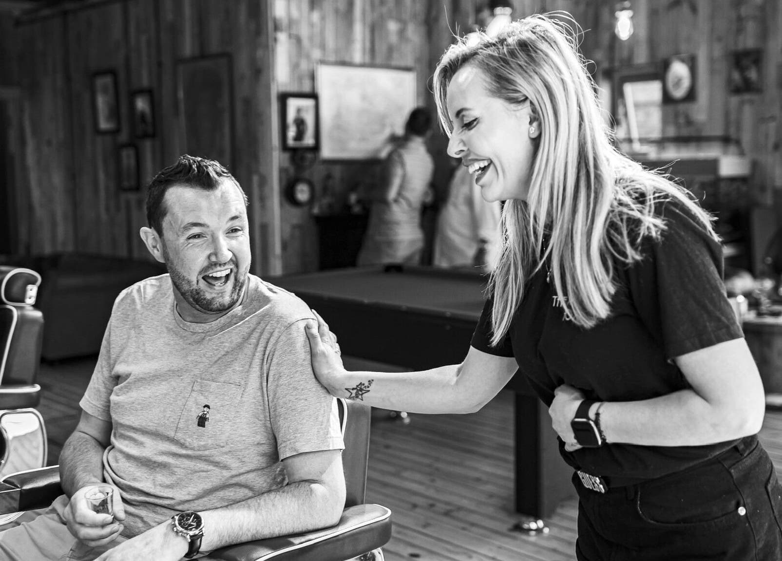 A stylist warmly greets a client at The Dapper Fox - Hampton Wick, England, GB.