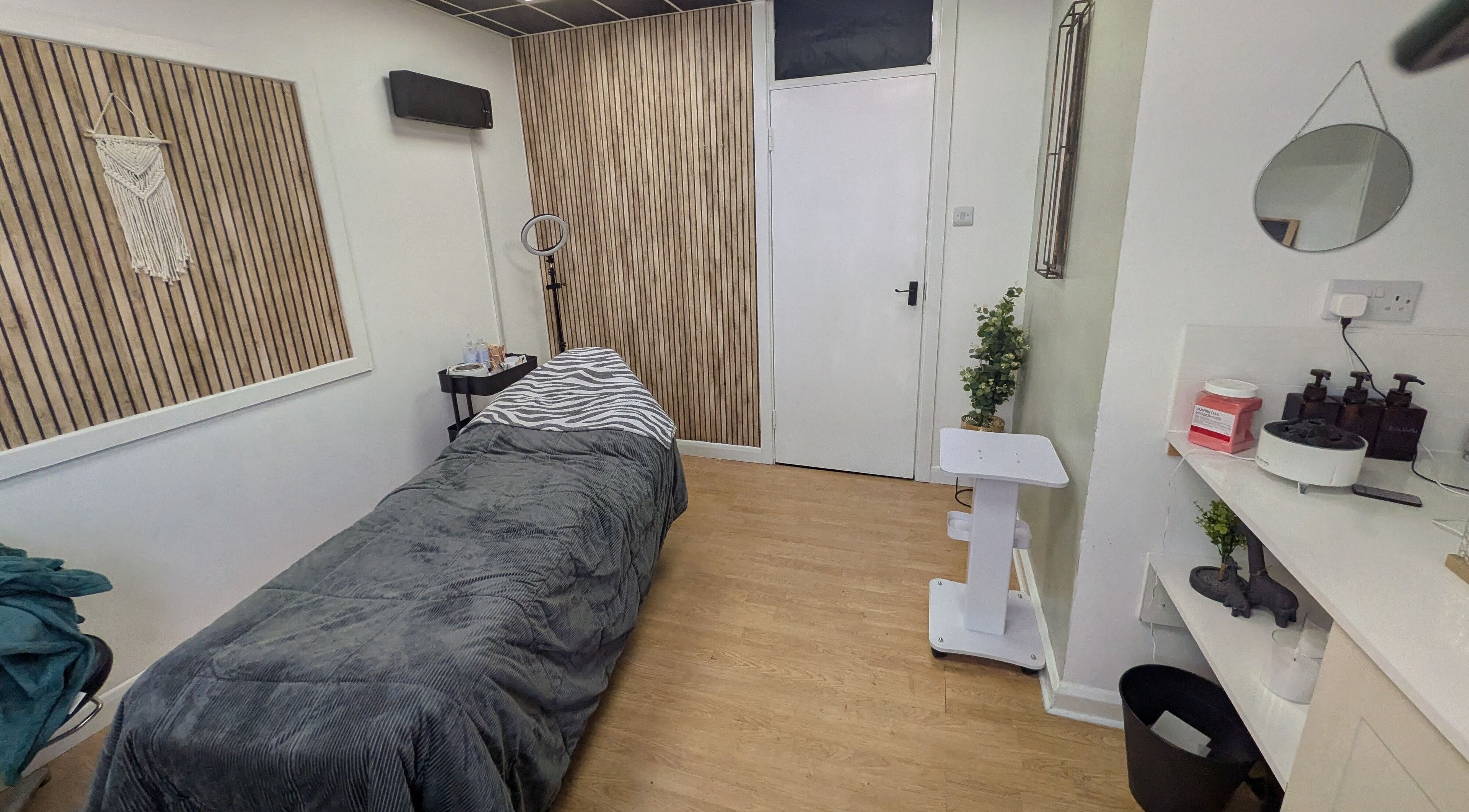 Cozy treatment room at Beauty Within, Castleford, England, GB with massage bed and calming decor.