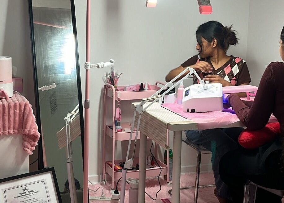 Nail technician at Beckyy’s Glam Atelier in Modbury North, South Australia, AU providing a relaxing manicure.