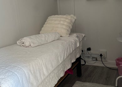 Tranquil massage room at Noella Mobile Spa in Cape Town, Western Cape, ZA, featuring a plush treatment bed.