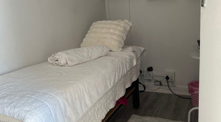 Tranquil massage room at Noella Mobile Spa in Cape Town, Western Cape, ZA, featuring a plush treatment bed.