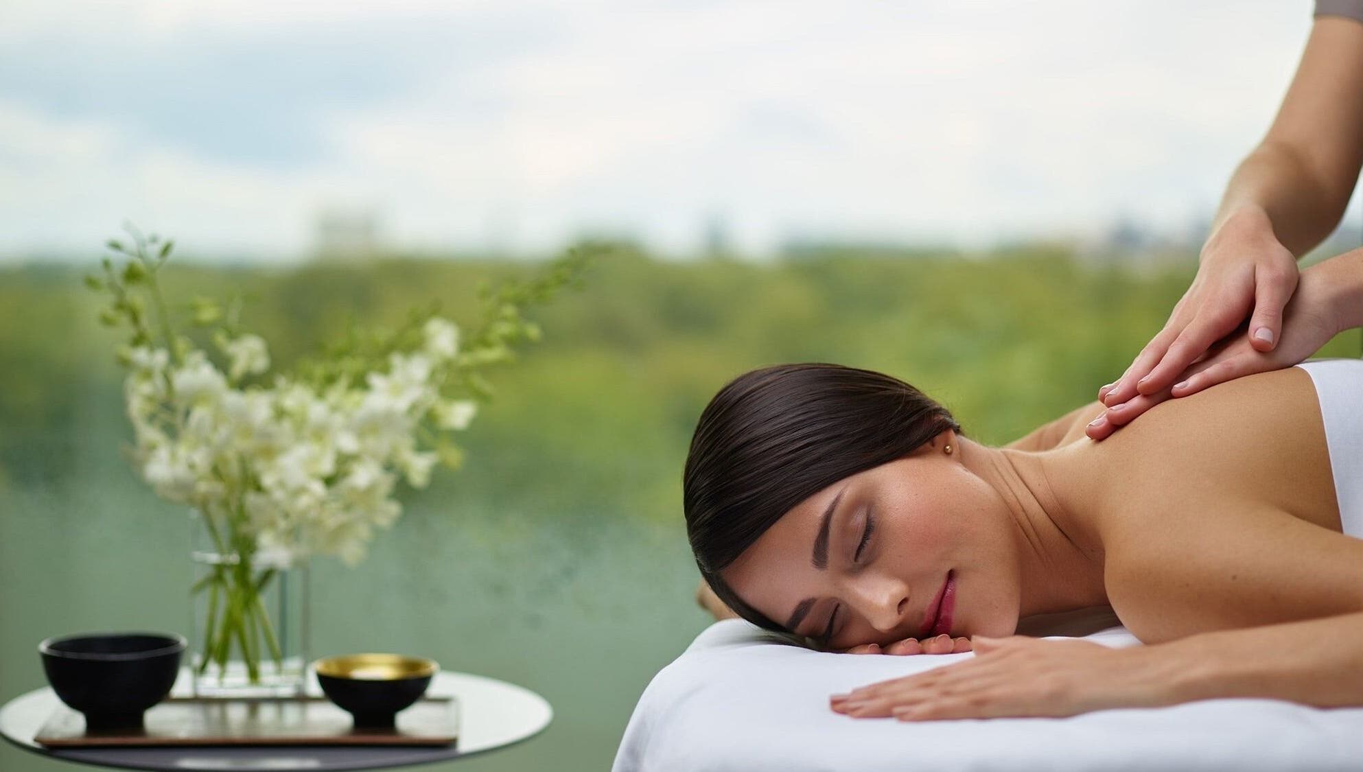 A relaxing massage session at Health Zone, Pawtucket, Rhode Island, US with scenic outdoor view.