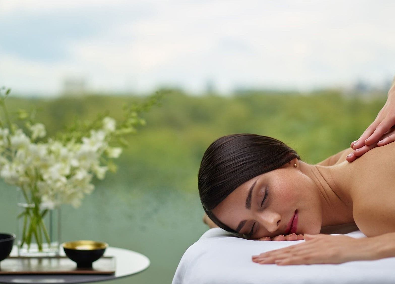 A relaxing massage session at Health Zone, Pawtucket, Rhode Island, US with scenic outdoor view.