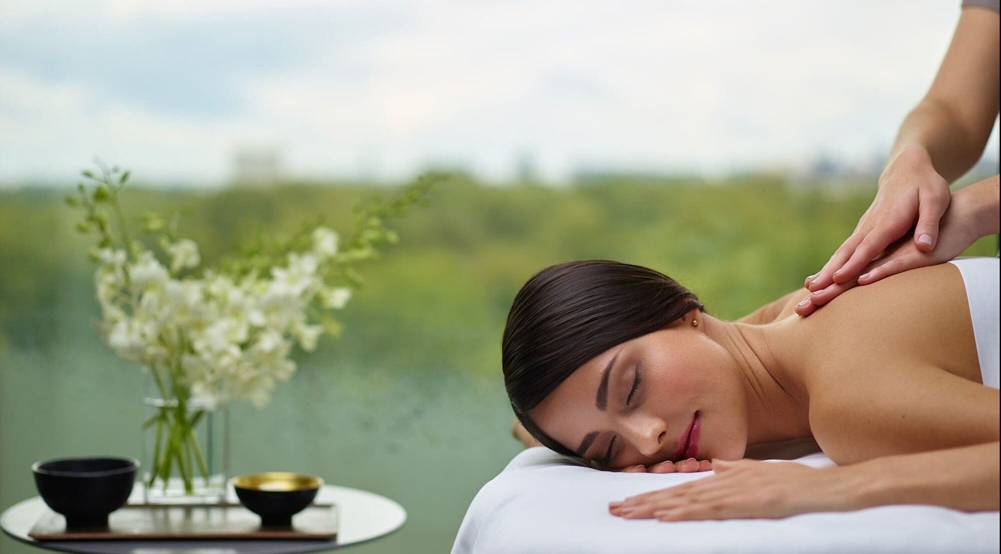 A relaxing massage session at Health Zone, Pawtucket, Rhode Island, US with scenic outdoor view.