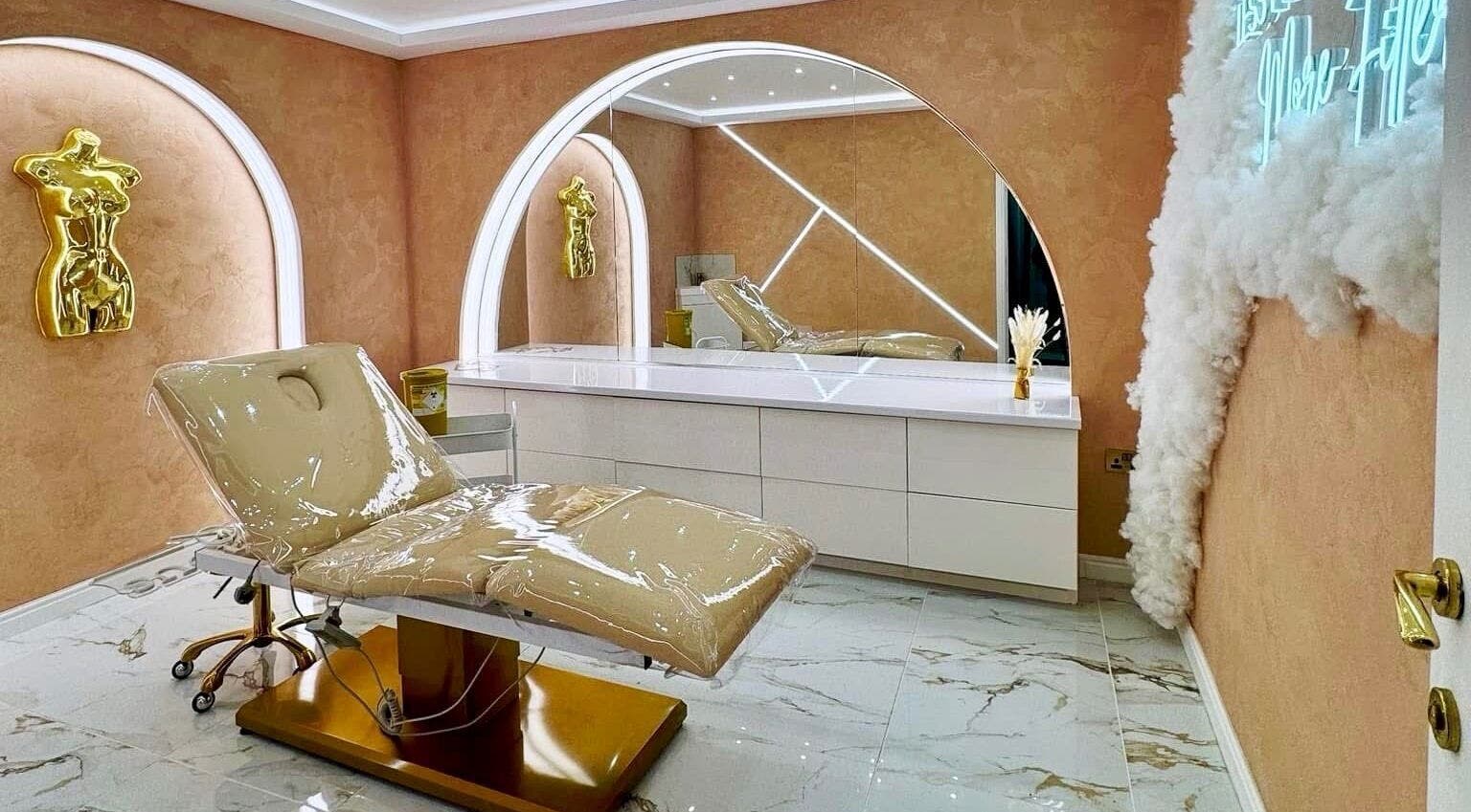 Luxurious beauty room at The Calm Lab, Conisbrough, England, GB with plush chair and artistic decor.