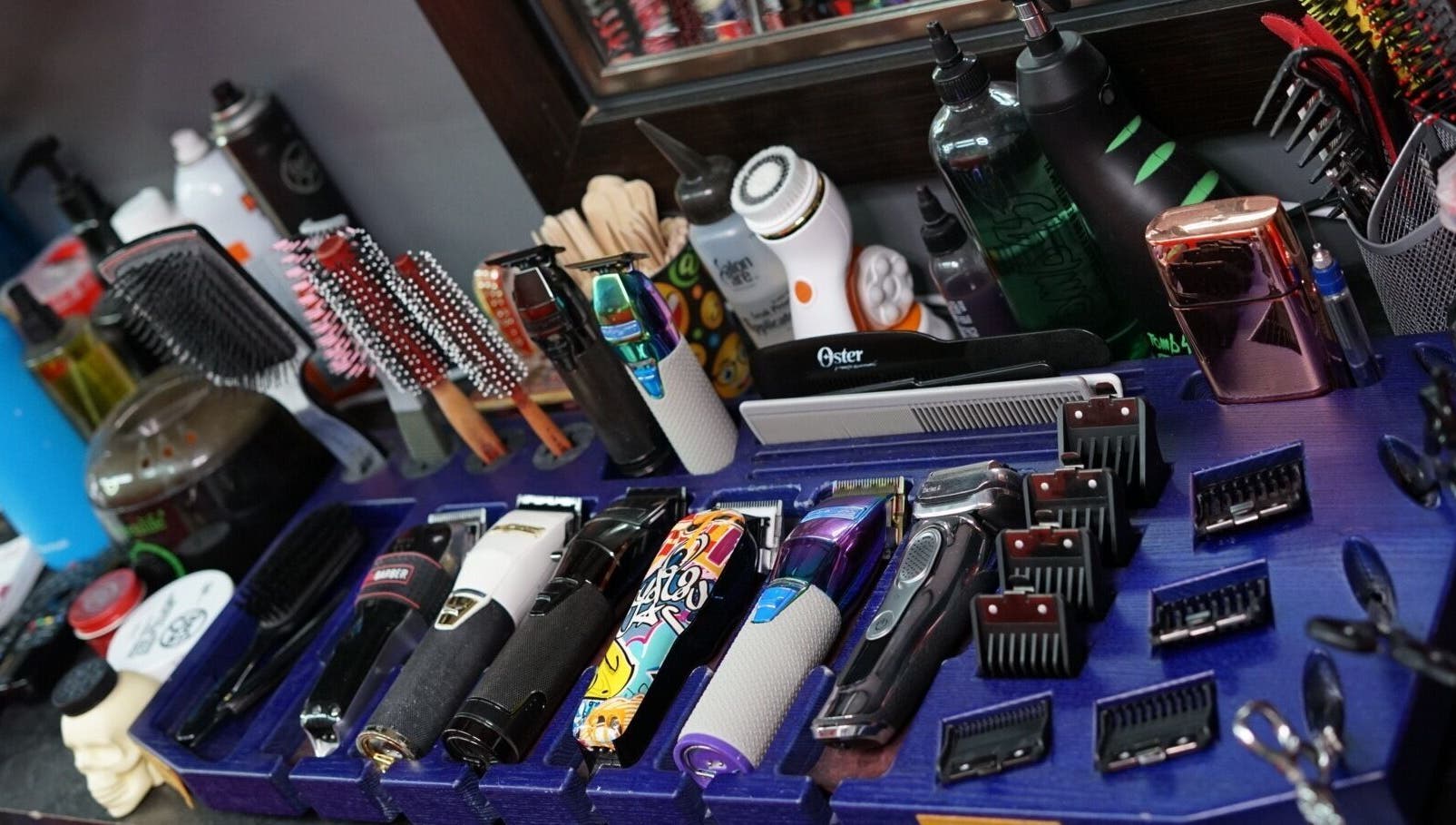 Diverse hair styling tools display at Toptcuts in London, Ontario, CA, showcasing professional grooming equipment.
