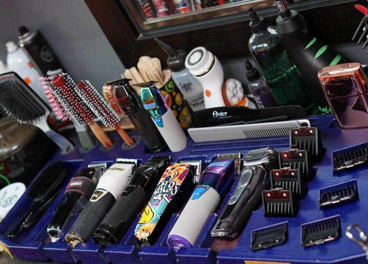 Diverse hair styling tools display at Toptcuts in London, Ontario, CA, showcasing professional grooming equipment.