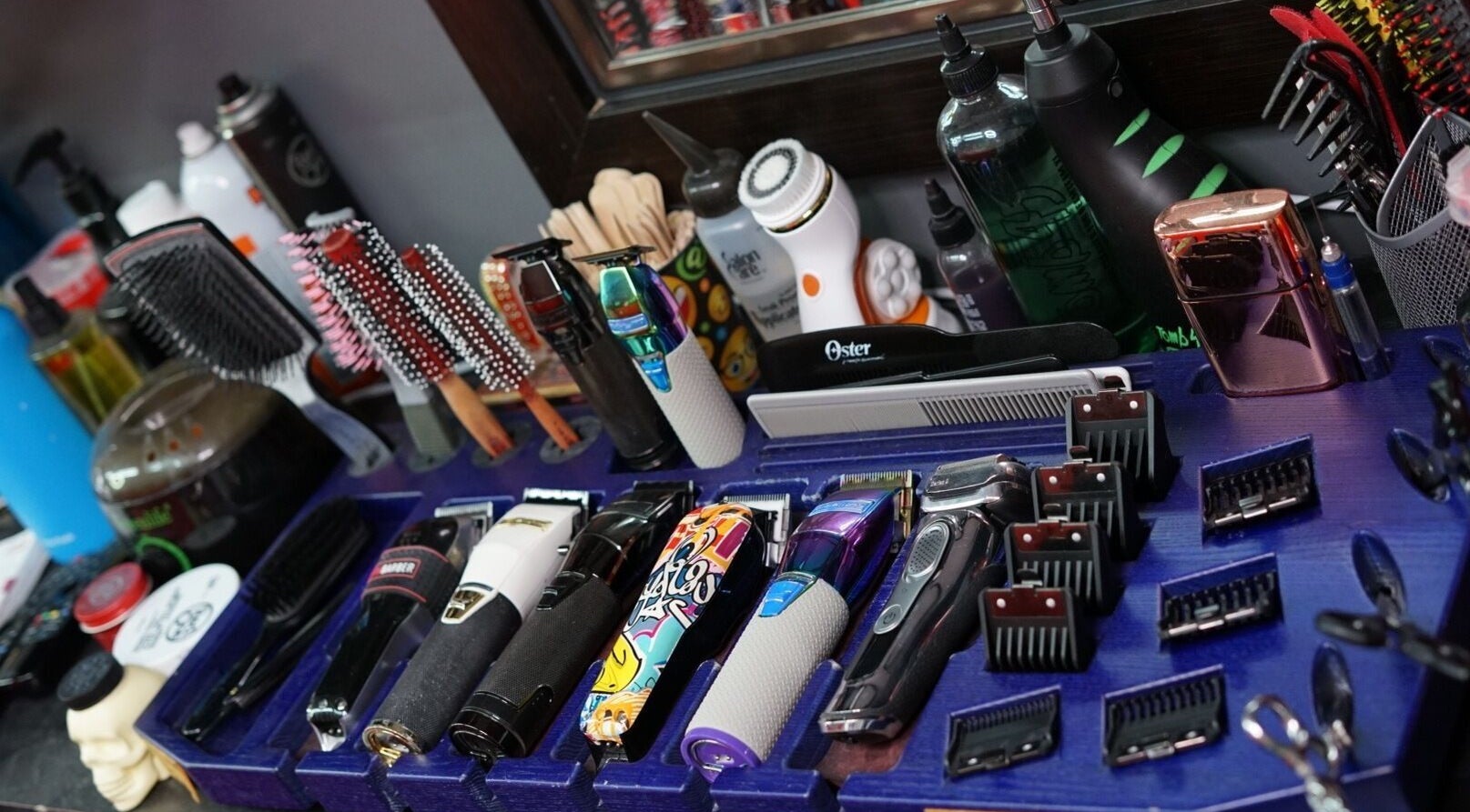Diverse hair styling tools display at Toptcuts in London, Ontario, CA, showcasing professional grooming equipment.