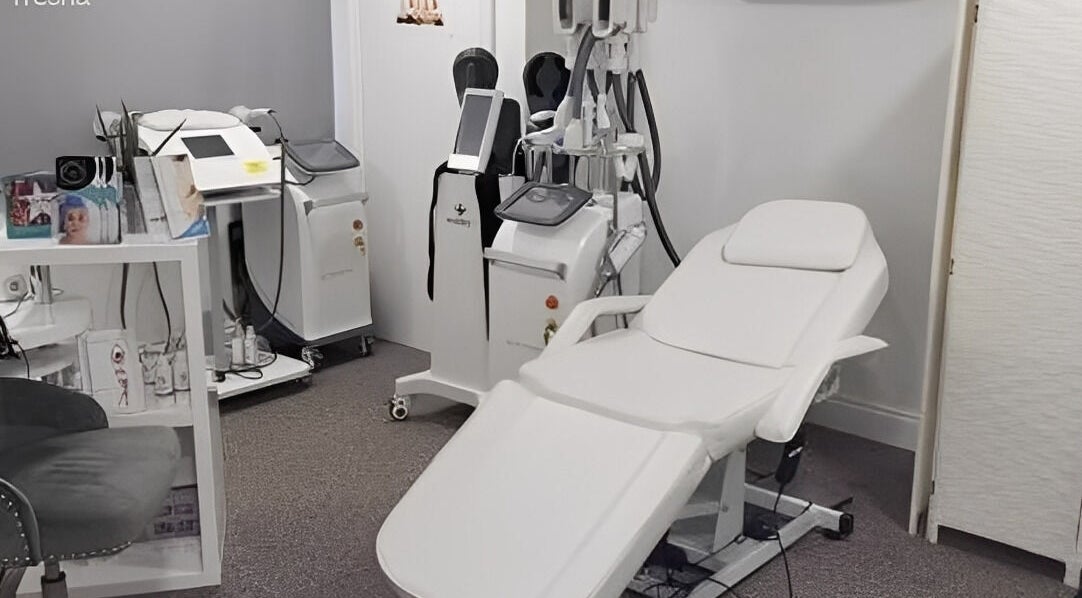 Modern treatment room at Abbeywell Aesthetics & Laser in Chertsey, England, GB, featuring advanced equipment.