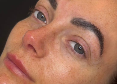Close-up of smooth skin and perfectly shaped brows at Enhanced by Lily, Crewe, England, GB.
