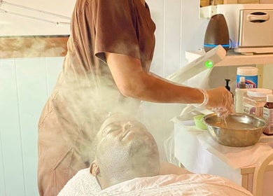 Facial steam treatment at Pampered Skin Oasis, Nassau, New Providence, BS. Relaxing spa experience.