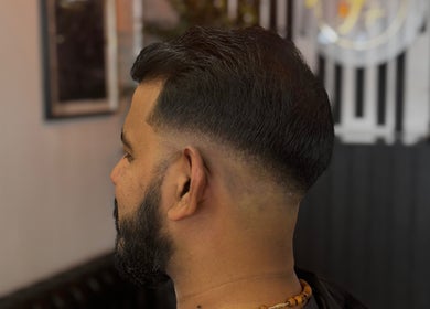Close-up of a stylish fade haircut at ASTROTRIMZ/THE FUTURE PLUS in Bedford, England, GB.