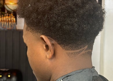 Close-up of a stylish haircut with a fade at ASTROTRIMZ/THE FUTURE PLUS, Bedford, England, GB.