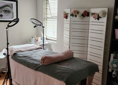 Relaxing treatment room at Ella Belle Beauty Studio, Cape Town, Western Cape, ZA, featuring a cozy massage bed.