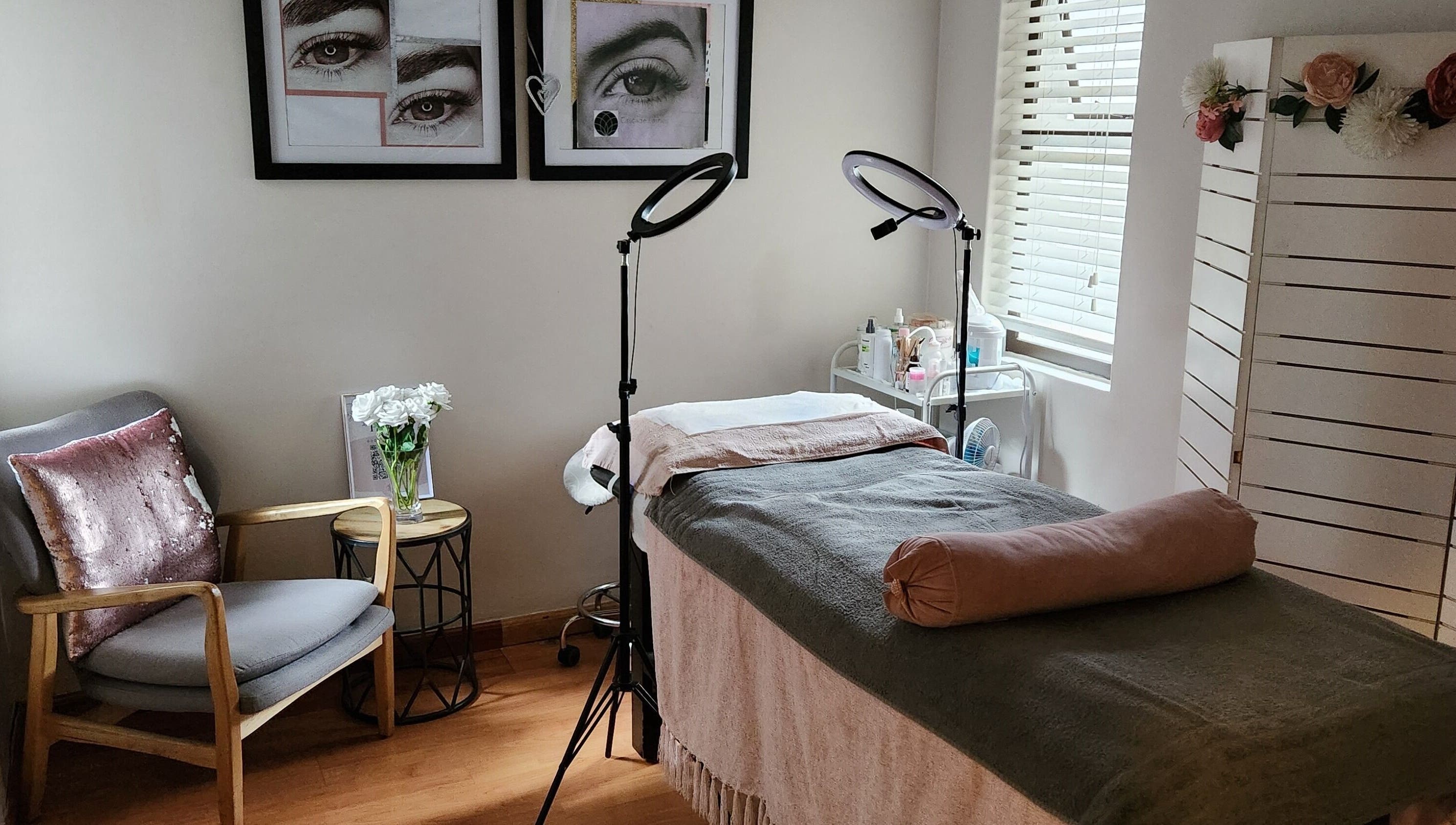 Relaxing treatment room at Ella Belle Beauty Studio, Cape Town, Western Cape, ZA with elegant decor and cozy seating.