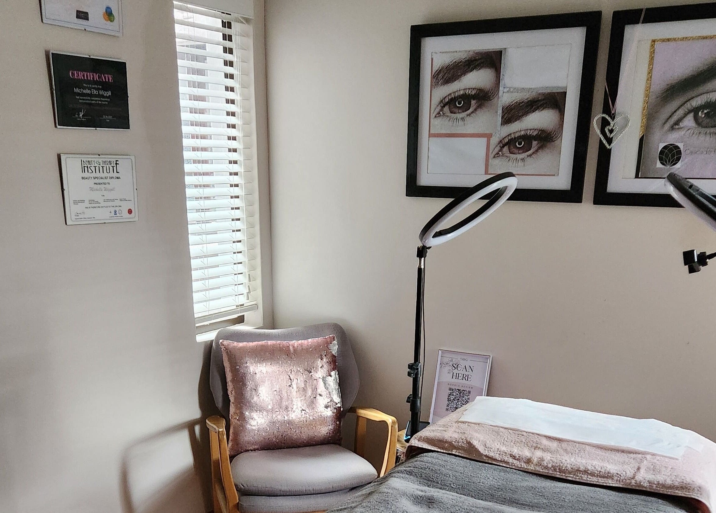 Ella Belle Beauty Studio room in Cape Town, Western Cape, ZA with cozy chair and framed eyebrow art.