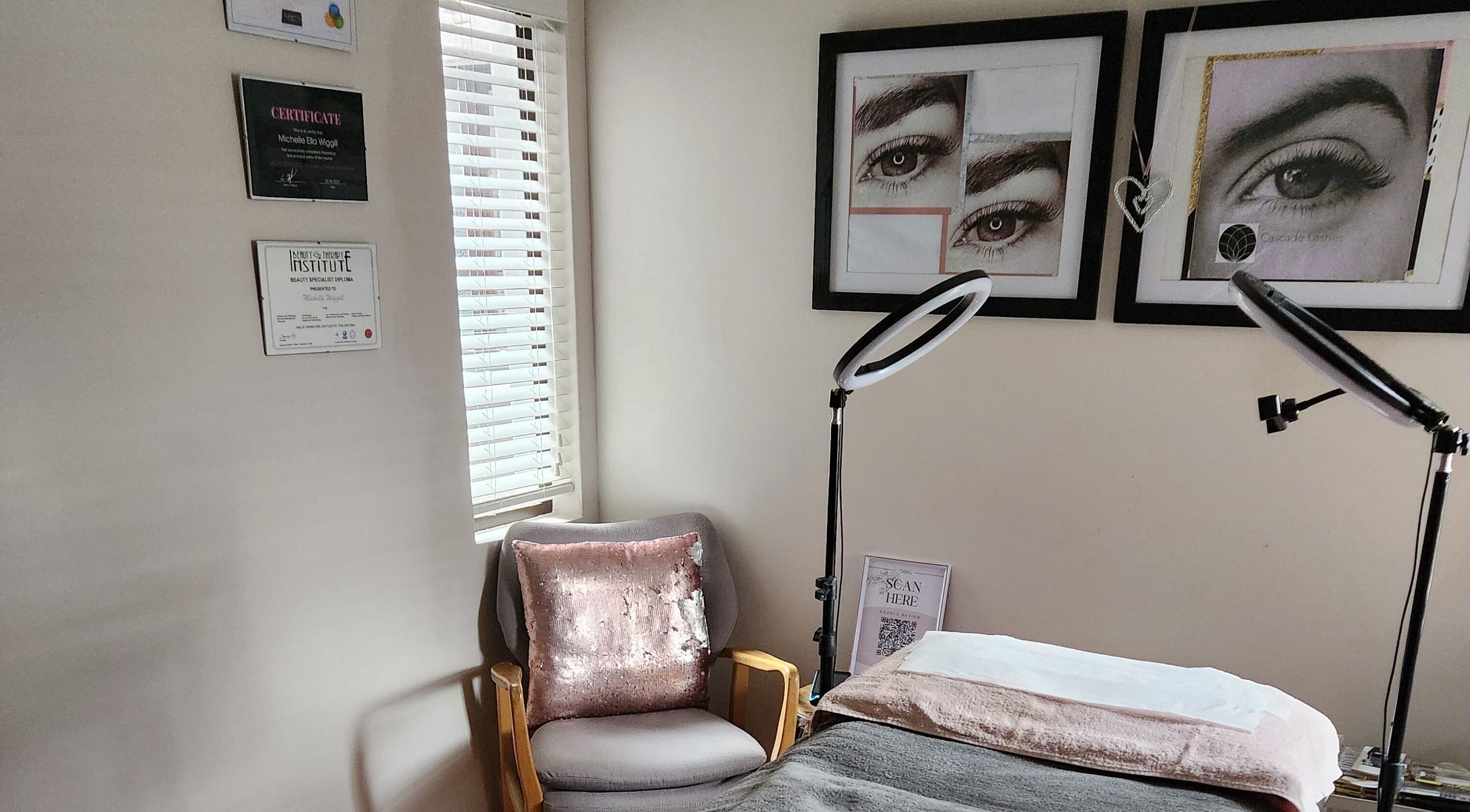Ella Belle Beauty Studio room in Cape Town, Western Cape, ZA with cozy chair and framed eyebrow art.