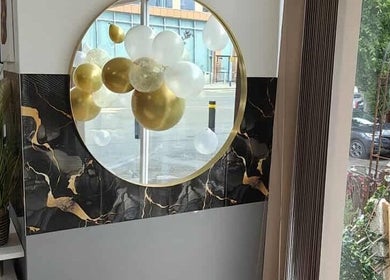 Chic interior with balloons at Chandu Hair & Beauty, Colwyn Bay, Wales, GB.