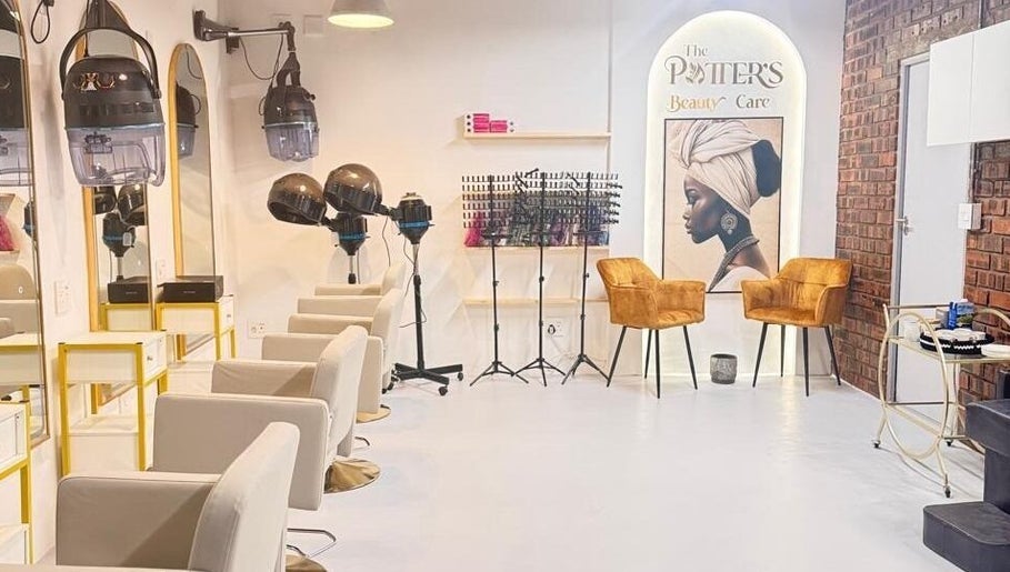 Modern salon interior at The Potter's Beauty Care in Cape Town, Western Cape, ZA with stylish chairs and art.