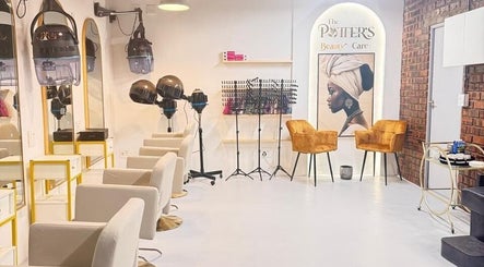 Modern salon interior at The Potter's Beauty Care in Cape Town, Western Cape, ZA with stylish chairs and art.
