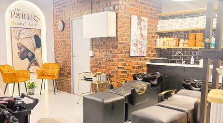 Stylish interior of The Potter's Beauty Care, Cape Town, Western Cape, ZA featuring salon chairs and shampoo area.