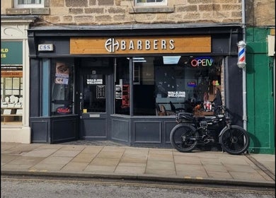 Front view of barber shop with open sign at Lch Beauty, Dalkeith, Scotland, GB.