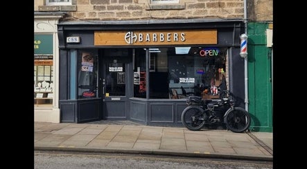 Front view of barber shop with open sign at Lch Beauty, Dalkeith, Scotland, GB.