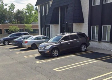 Spacious parking area at Yadior Beauty in Southfield, Michigan, US with multiple vehicles.