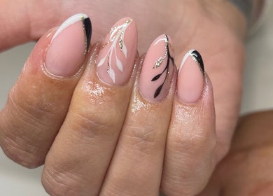Elegant nail art at Perfections Nails and Beauty, Winsford, England, GB featuring black and gold accents.