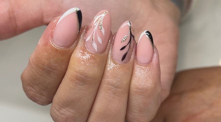 Elegant nail art at Perfections Nails and Beauty, Winsford, England, GB featuring black and gold accents.