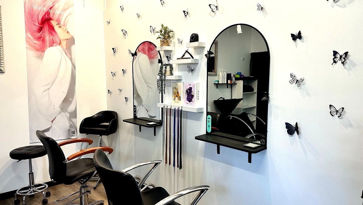 Elegant styling chairs and mirrors at The Hair Barn Toolleen, Toolleen, Victoria, AU, with butterfly decor.
