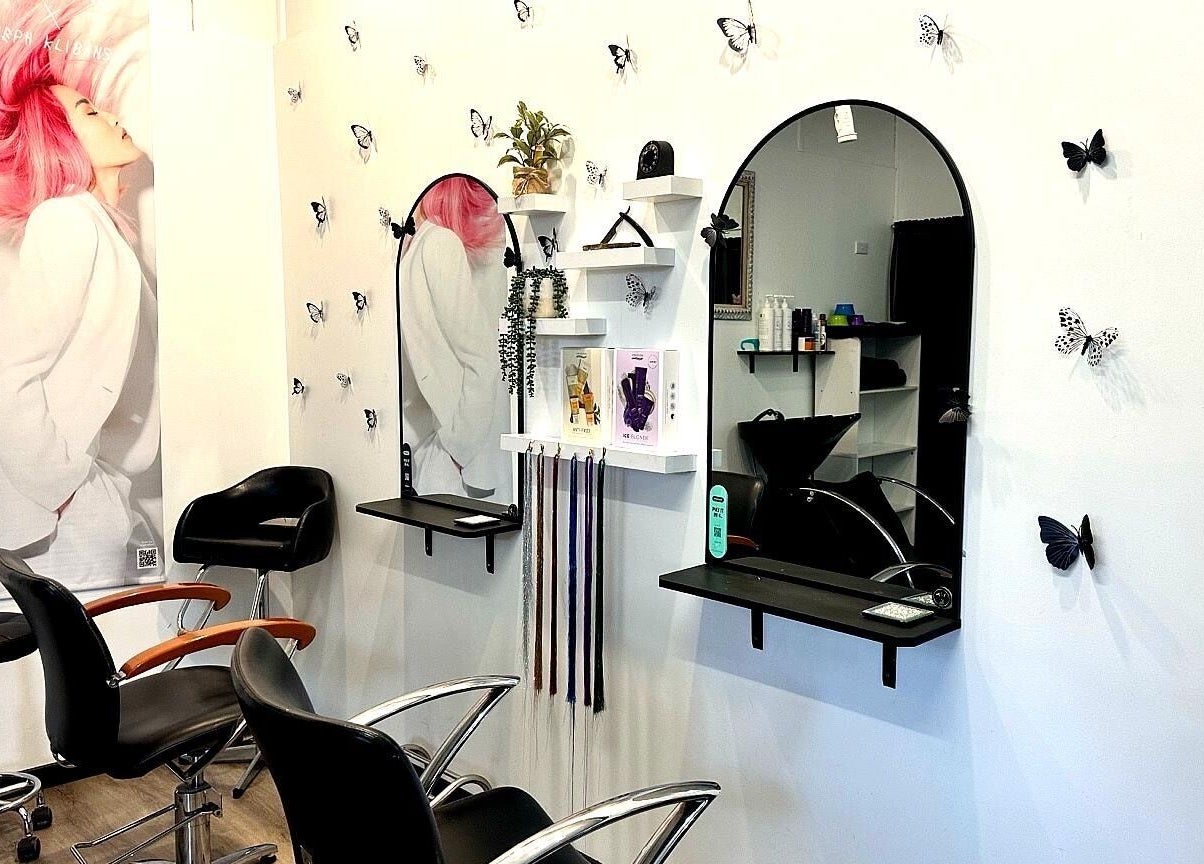 Elegant styling chairs and mirrors at The Hair Barn Toolleen, Toolleen, Victoria, AU, with butterfly decor.
