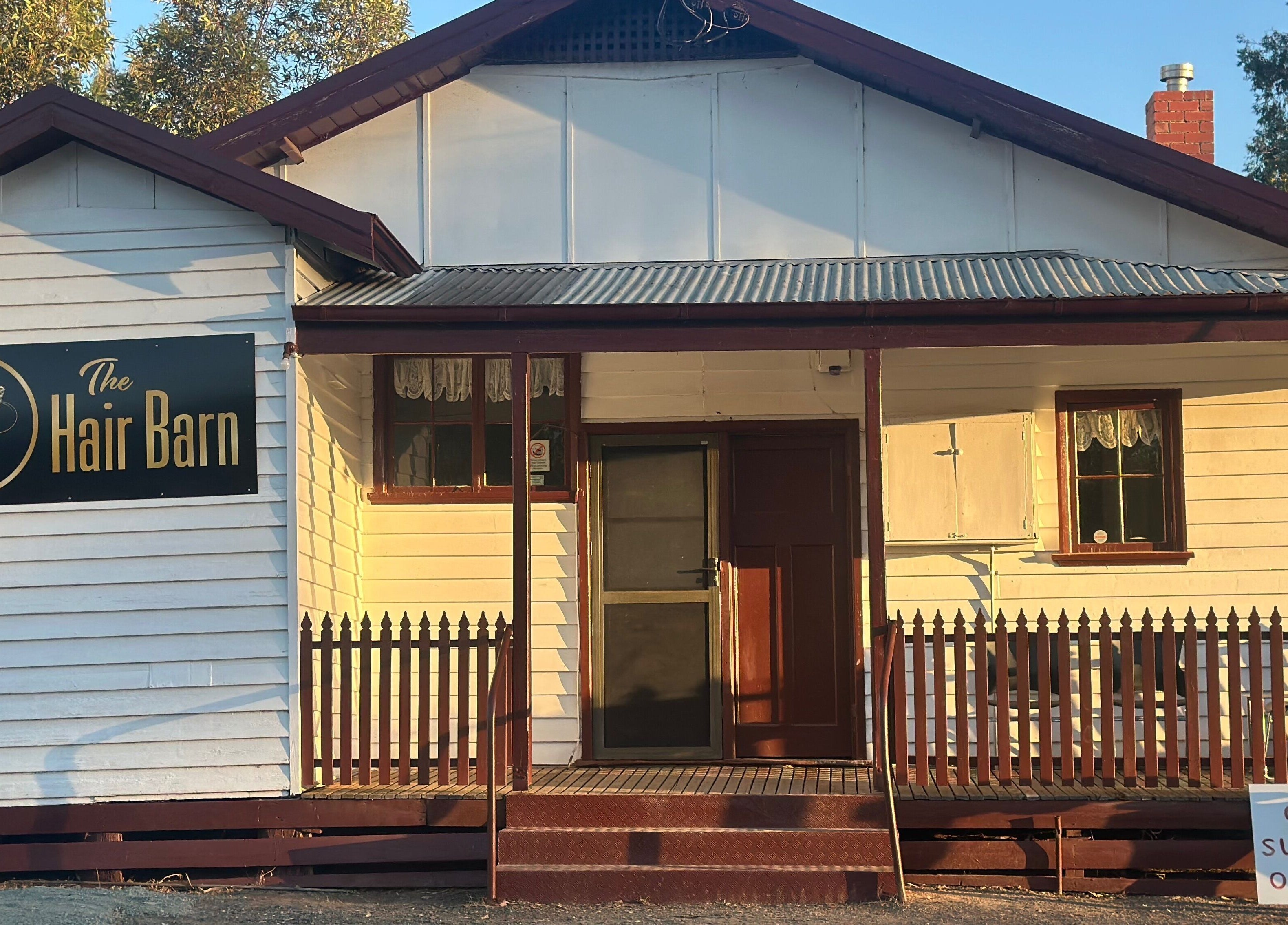 The Hair Barn Toolleen in Toolleen, Victoria, AU features a welcoming rustic facade.