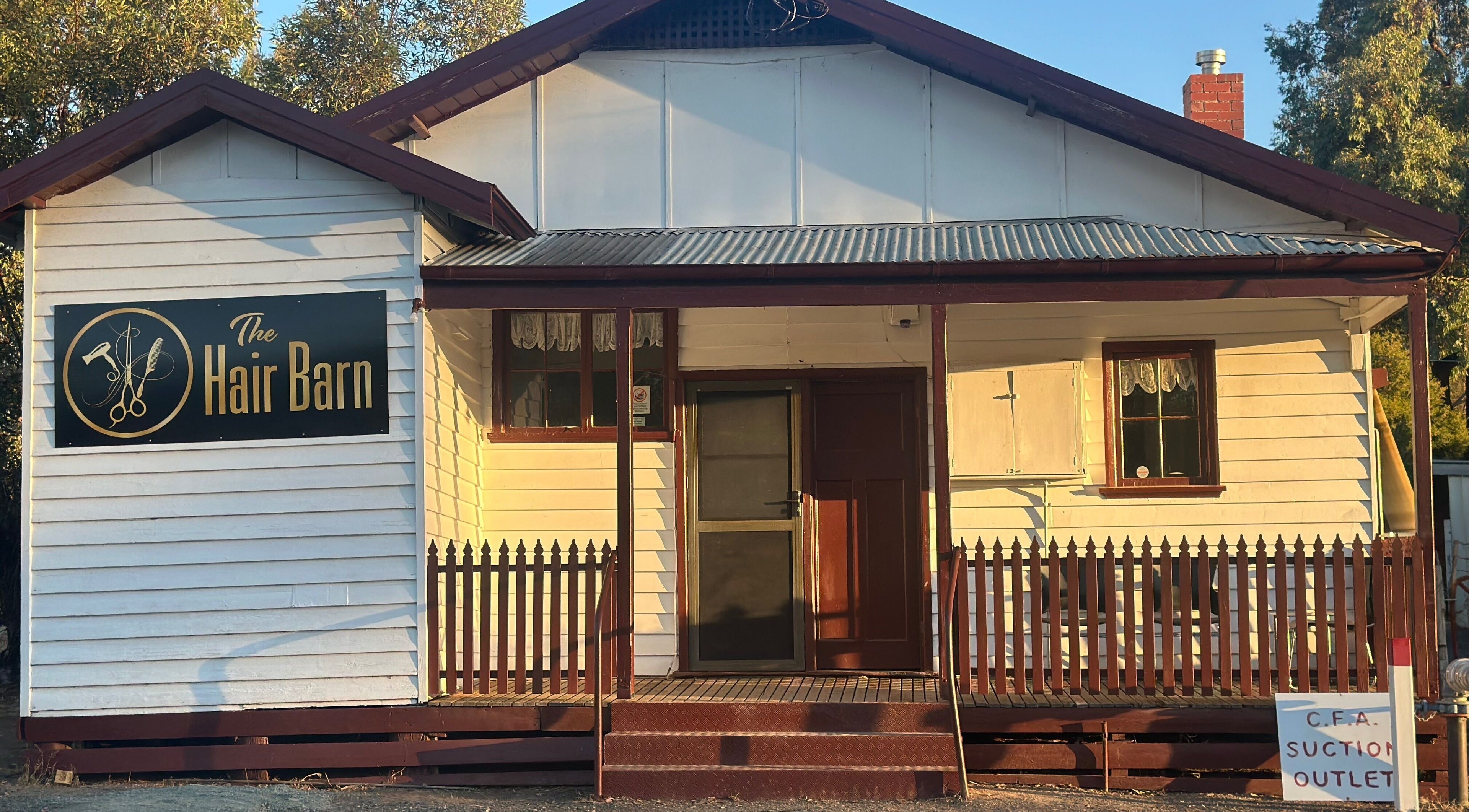 The Hair Barn Toolleen in Toolleen, Victoria, AU features a welcoming rustic facade.