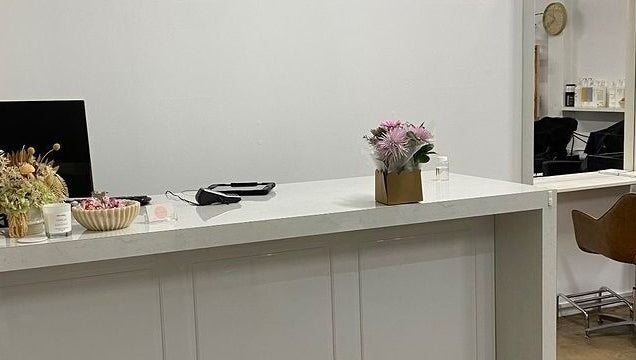 Reception desk with flowers at Hair Divine Studio in Mount Isa, Queensland, AU.
