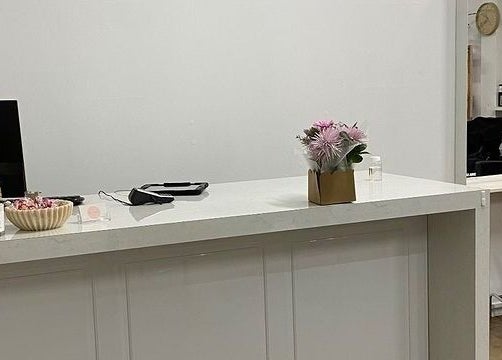 Reception desk with flowers at Hair Divine Studio in Mount Isa, Queensland, AU.