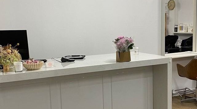 Reception desk with flowers at Hair Divine Studio in Mount Isa, Queensland, AU.