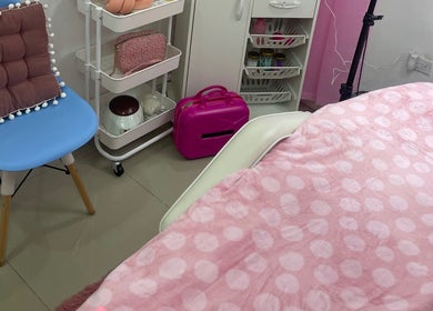 Cozy treatment room at Pro Belle Co in Kingston, New York, US, showing a pink-themed relaxing setup.