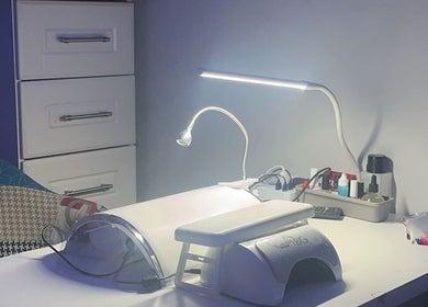 Modern nail station at Nailssbybeccax in County Mayo, IE with manicure tools and LED lamp.