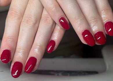 Elegant red manicure at Nailssbybeccax in County Mayo, IE showcasing flawless nail art.