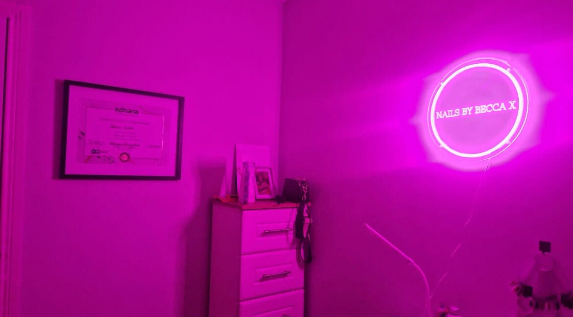 Vibrant neon-lit room at Nailssbybeccax in Ballina, County Mayo, IE. Stylish and modern interior design.