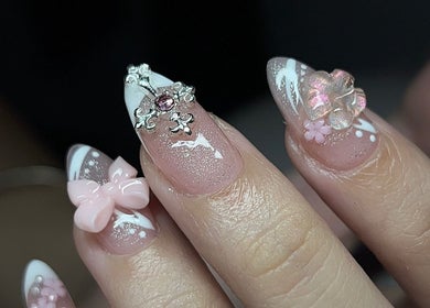 Elegant 3D nail art design with gems and bows at VOULOIR, San Jose Del Monte, Central Luzon, PH.